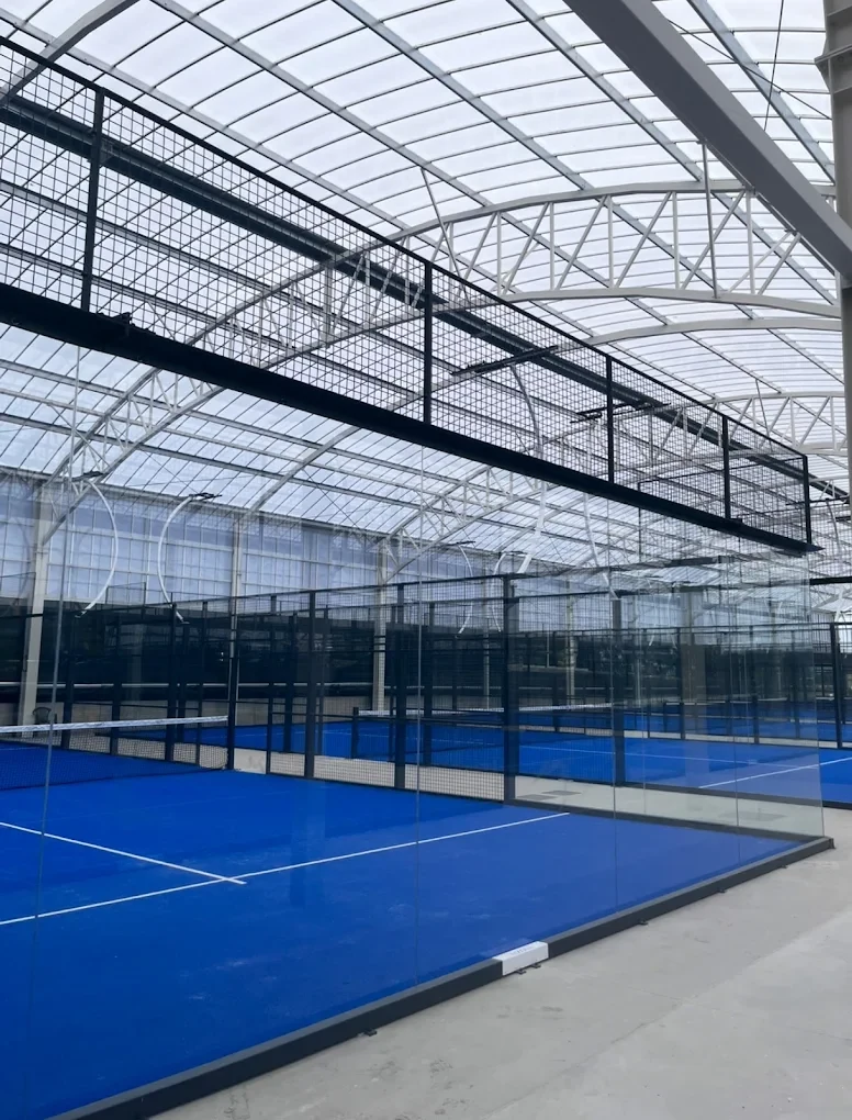 Tizona’s blue covered padel courts and their tall translucent architectural roof